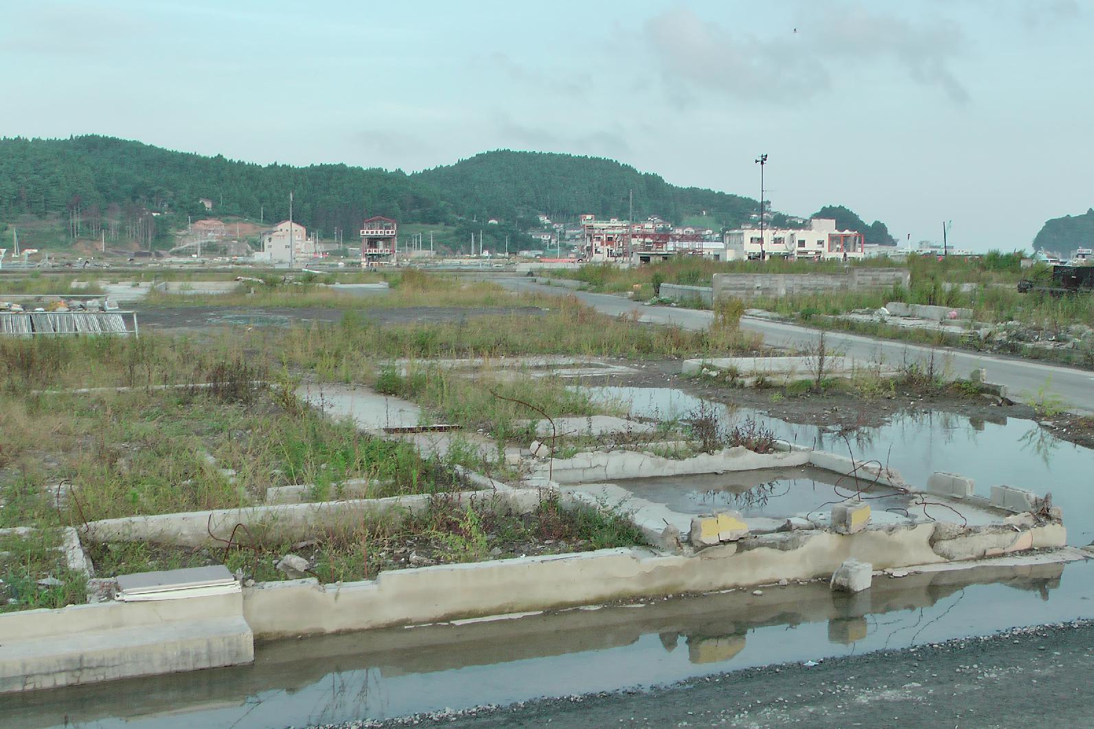 This residential area is flooded because the country sank through the earthquake.