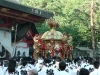 While carrying the portable pagodas around the shrine they are being shaken to honour the Shinto good Susanoo.