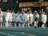 The pagoda is being carried and accompanied by Shinto monks and priests.