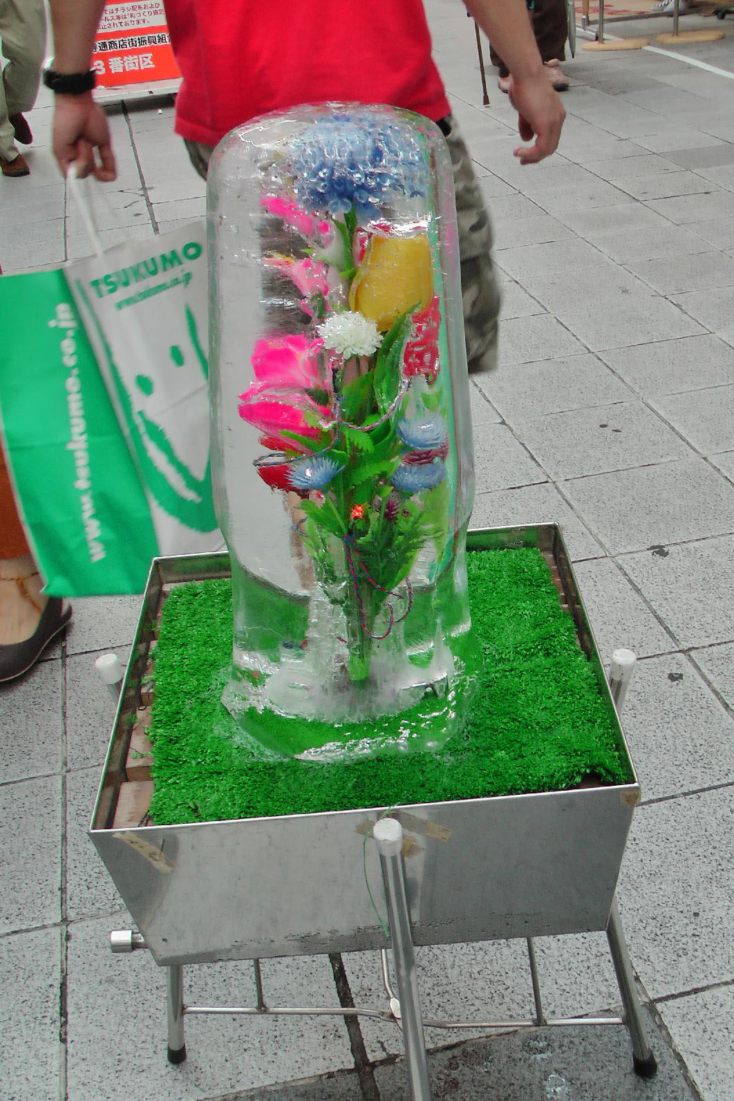 Ice blocks everywhere with frozen plastic flowers or ...
