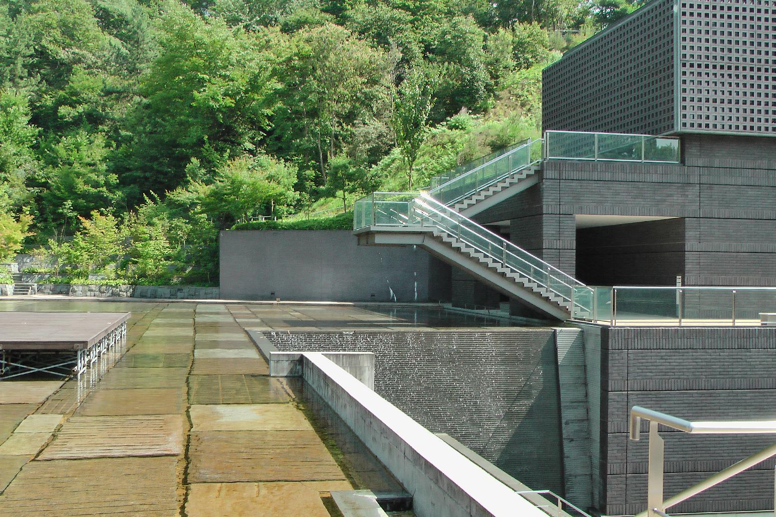 a fountain is built through the whole building complex